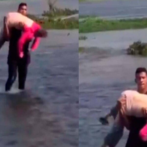 En redes sociales se viraliza la fotografía  de un joven que carga a una anciana durante su paso por el Río Bravo