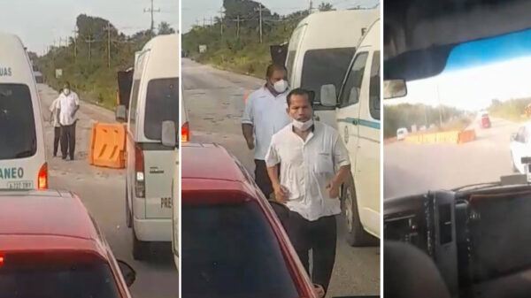 Choferes retiran barreras de señalización por socavón en carretera.