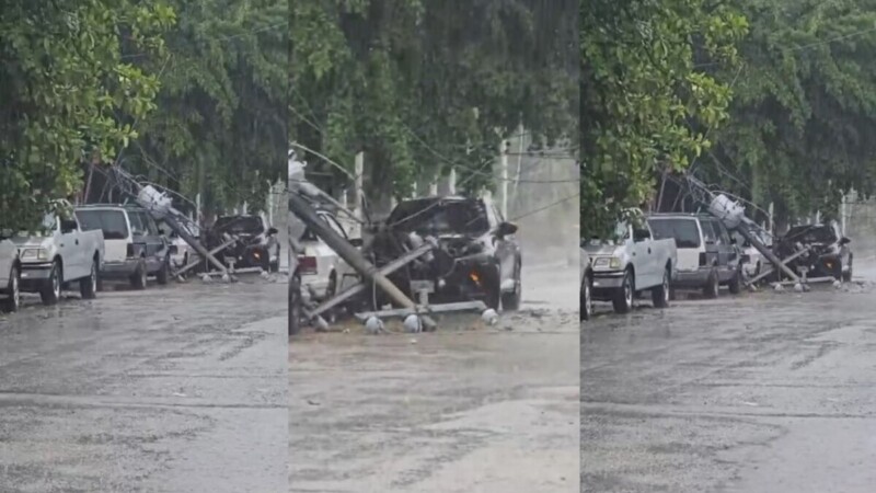 Lluvias derriban poste de CFE y aplastan vehículos en Cancún