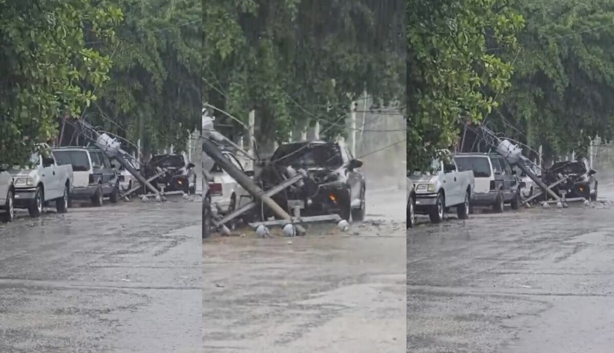 Lluvias derriban poste de CFE y aplastan vehículos en Cancún
